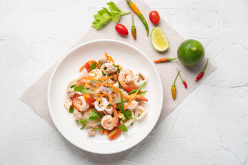 Wall Mural - Spicy Glass Noodle Salad,mixed shrimp with minced pork and squid with boiled vermicelli in chili sauce(Yum Woon Sen).Top view