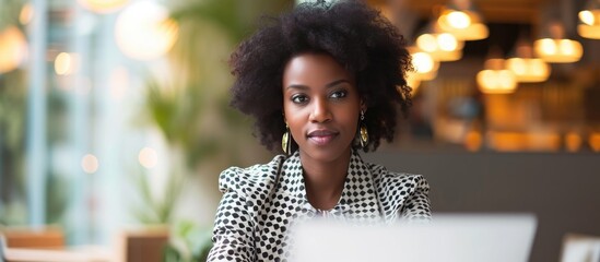 Poster - Stylish African American businesswoman doing an office interview, with laptop and copy space.