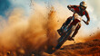 A dynamic image of a motocross rider airborne over a dirt track dust trailing behind.