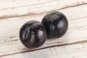 Two ripe sweet black plums