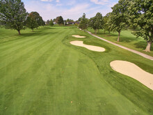 Aerial Serene Golf Course With Mature Trees And Sand Bunkers In Fort Wayne