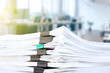 stack of reporting paper documents on a business table in the office, business documents for annual reports. Business analytics. Business office concept, soft focus.