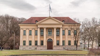 Canvas Print - The Prinz Carl Palais in Munich is a mansion built in the style of early Neoclassicism timelapse. It was also known as the Palais Salabert and the Palais Royal with flag on top. Germany