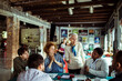 © Davor - Diverse group of colleagues brainstorming in a creative workshop with senior leader