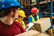 © Davor - Workers in safety gear checking inventory in warehouse