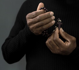  black man praying to god with black grey background with people stock image stock photo