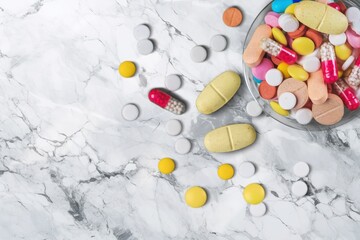 Sticker - Pills medical capsules in different colors on desk