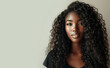 © CFK - Portrait of a beautiful woung woman with brown skin and long curly black hair.  Copy space for text, advertising, message, logo