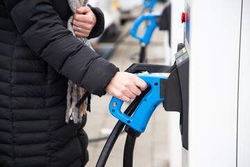 charging an electric car on the street