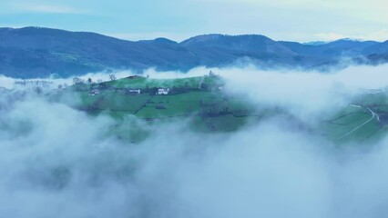 Wall Mural - Aerial drone view of the winter landscape around the town of Gainza and Amezqueta and the Txindoki Mountain. Aralar Mountain Range. Goierri region. Gipuzkoa. Basque Country. Spain. Europe