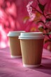 © foto.katarinka - Two paper cups of coffee on a pink tablecloth against a pink background