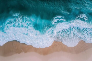 Wall Mural - Aerial view of ocean waves crashing onto the beach A natural and refreshing seascape