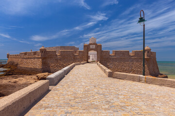 Wall Mural - Fort San Sebastian and the stone breakwater bridge leading to it on a sunny day.