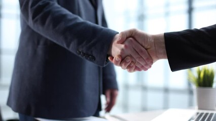 Wall Mural - Businessmen shake hands after a successful deal