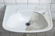© DBA - Bathroom sink before and after cleaning split view - housekeeping