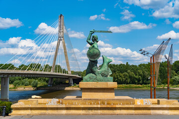 Canvas Print - Statue of Syrenka, the Warsaw Mermaid, at Vistula River bank in Warsaw, Poland