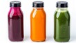 A trio of juice bottles containing beet, spinach, and carrot juices, each with a glossy black cap, isolated on a pure white surface