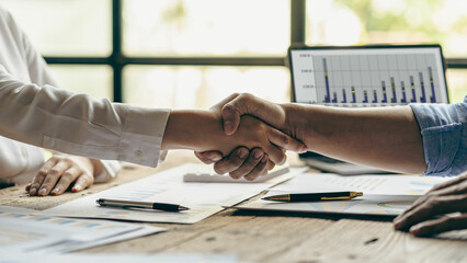 Handshaking, meeting and business people in partnership cooperation and working on agreements in the workplace Thank you teamwork, financial business concept Close-up pictures