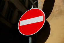 Road sign in the form of a white rectangle in a red circle. No entry .