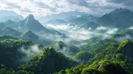 Wall Mural -  an aerial view of a mountain range with green trees and mountains in the distance, with clouds in the sky, and low lying clouds in the foreground, in the foreground.