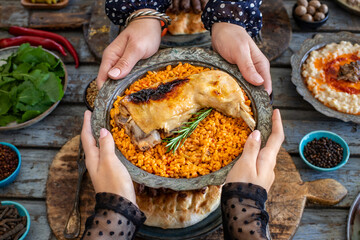 Wall Mural - Grilled chicken leg with bulgur wheat in the copper bowl. 