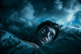 Fototapeta Zwierzęta - A young man wakes up from a nightmare. This causes insomnia and fear and anxiety.