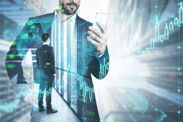 Canvas Print - Back view of small young businessman with smartphone standing on blurry city background with forex chart and map hologram. Success, finance, trade, future and tomorrow concept. Double exposure.