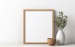 © your_inspiration - Blank wooden picture frame mockup on off white wall in modern interior. Vertical artwork template mock up for artwork, painting, photo or poster in interior design with green plants. AI Generative.