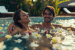 happy smiling couple enjoying hot tub with flowers