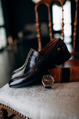 Wall Mural - men's accessories of the groom are black leather shoes and a watch