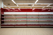Empty shelves in a grocery store, economic crisis, problems with delivery and production of food products