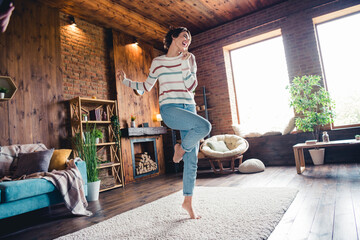 Wall Mural - Full body photo of crazy positive lady have fun dancing comfy carpet barefoot modern apartment indoors