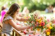 woman arranging flowers on party tables