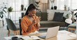 © Coetzee/peopleimages.com - Black woman, success in home office and celebration at laptop for remote work, social media or excited blog. Happy girl at desk with computer for winning email, achievement and good news in freelance
