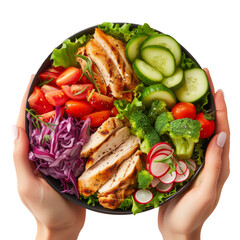 Two hands holding a bowl with a fresh and healthy salads with chicken stripes, lettuce, tomatoes and cucumber, isolated on a transparent background