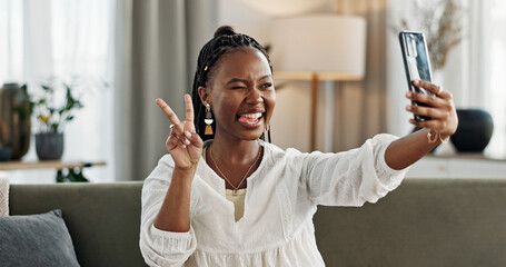 Poster - Smile, selfie and black woman with peace sign, funny face and relax on sofa in living room. V hand, picture and happy African person or influencer at home on couch on social media with tongue out