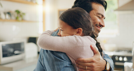 children, father and daughter hug in the kitchen for love, trust or bonding together in their home. 
