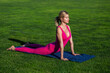 © Yevhen - Yoga in the park. Woman doing yoga in morning park. Meditation in morning sunny day. Fitness lady outdoors, yoga stretching exercises