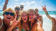 © robert - Group of teenage young people having fun in the sea on spring break