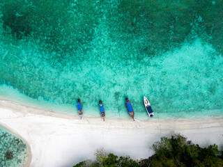 Wall Mural - Chicken Island, Krabi, Thailand. Top aerial drone view of a paradise beach, ocean, white sand, and longtail boats 