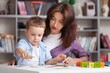 © BillionPhotos.com - Teacher learning little child in classroom. Preschool education concept