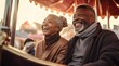 © Marharyta Tsapenko - Elderly black couple riding on a carousel smiles