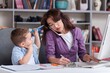 © BillionPhotos.com - Beautiful young mother working it home with little spoiled child.
