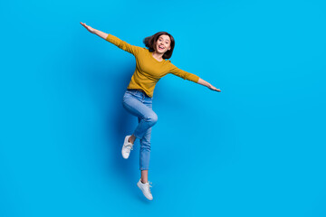 Wall Mural - full length photo of excited pretty lady dressed shirt flying arms sides jumping high empty space is