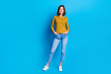 Wall Mural - full length photo of pretty shiny woman wear shirt smiling walking empty space isolated blue color b