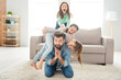 Portrait of lovely funny cheerful family playing daddy piggy backing spending holiday at home house living-room indoors