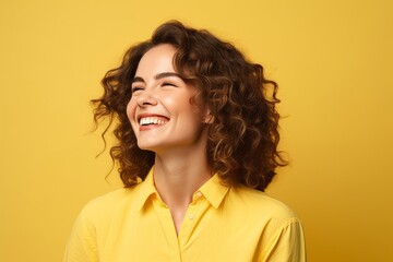 Poster - Portrait of happy young woman with curly hairstyle on yellow background