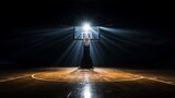 Fototapeta Sport - A lone basketball net under a spotlight, casting shadows on a court