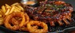 Grilled rib steak with fries and onion rings.