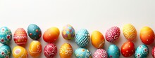 Colorful Easter Eggs On White Studio Background, Banner With Copyspace, Top View